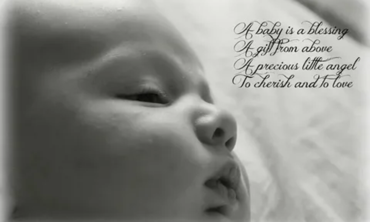 A close-up of tiny baby feet with Baby Blessings Quotes that express heartfelt wishes for a happy and blessed life.